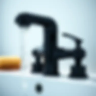 Close-up of black chrome faucet with water flowing